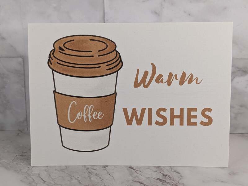 A coffee themed greeting card wishing someone warm wishes for a blessed day.