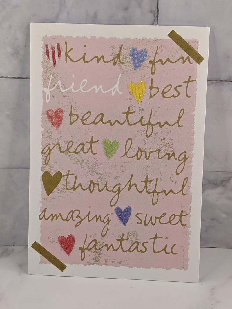 A pink greeting card of friendship with a design of hearts and a message about a friend being a sister you choose.