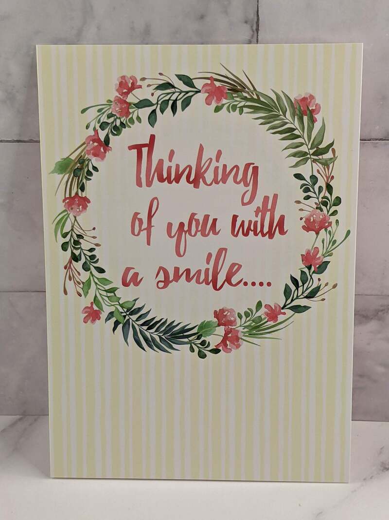 A greeting card for a Secret Sister with an image of a floral wreath and a happy sentiment.