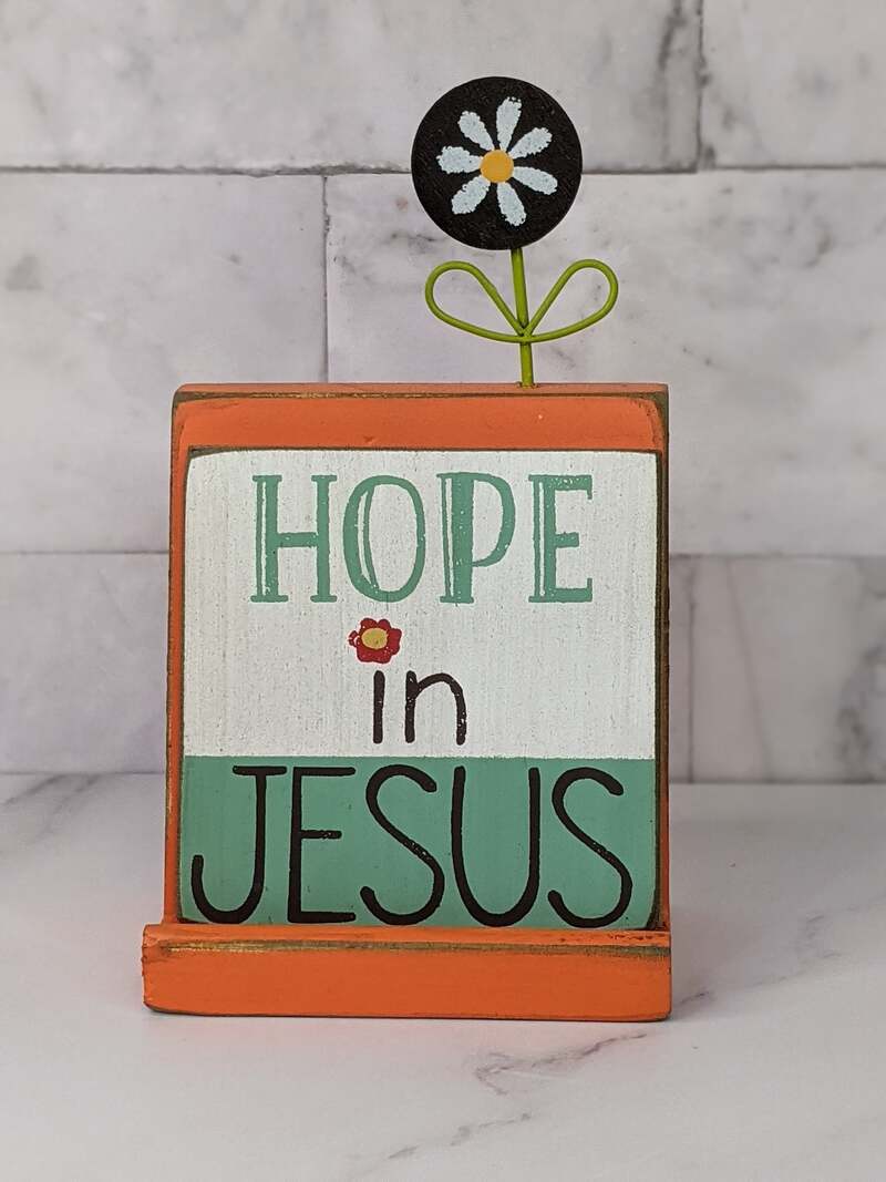 A message block with four interchangeable Christian messages and a daisy flower motif.