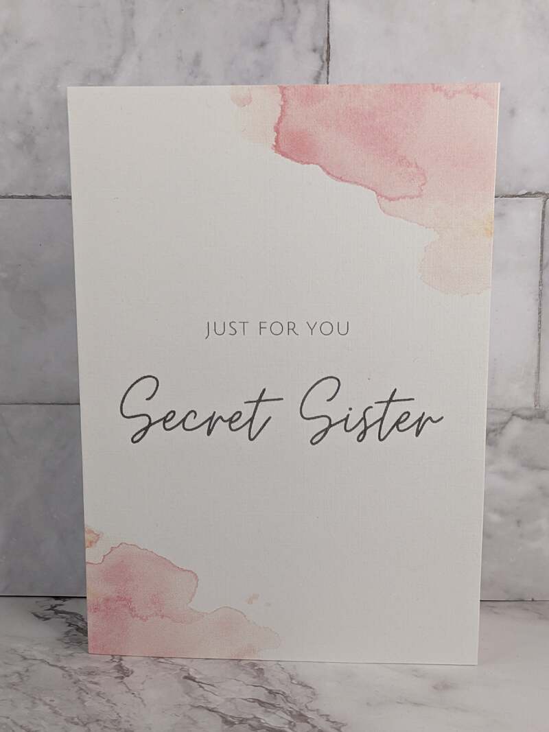 "Just for You Secret Sister" greeting card with a pink and white watercolor design.