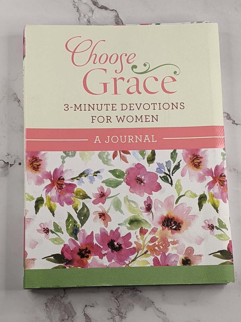Choose Grace 3-Minute Devotions For Women, A Journal Book with a pink floral design on the cover.