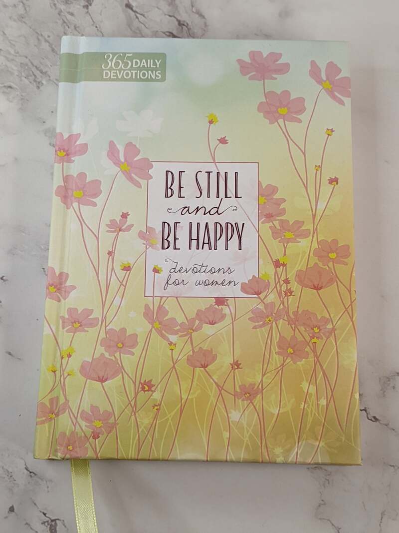 Be Still and Be Happy Devotions for Women, a hardcover gift book.