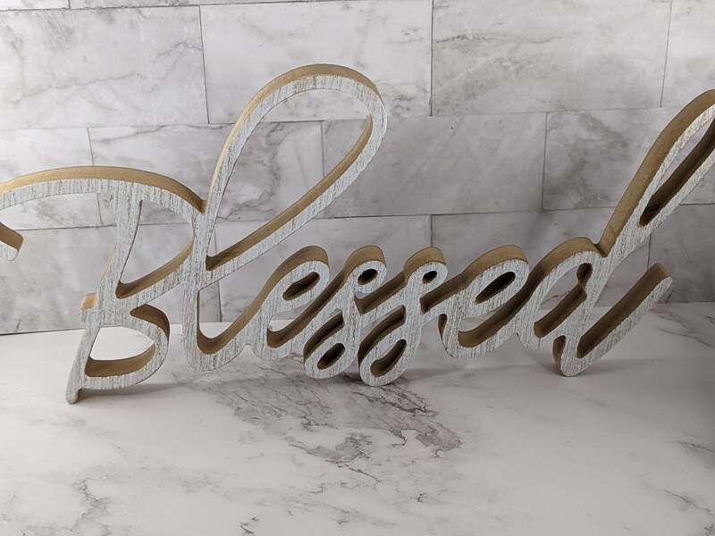 This home decor sign features the word, "Blessed."