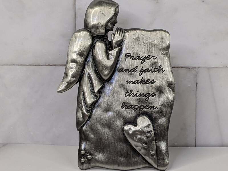 "Prayer and faith makes things happen." A pewter angel tabletop plaque with a reminder to pray with faith!