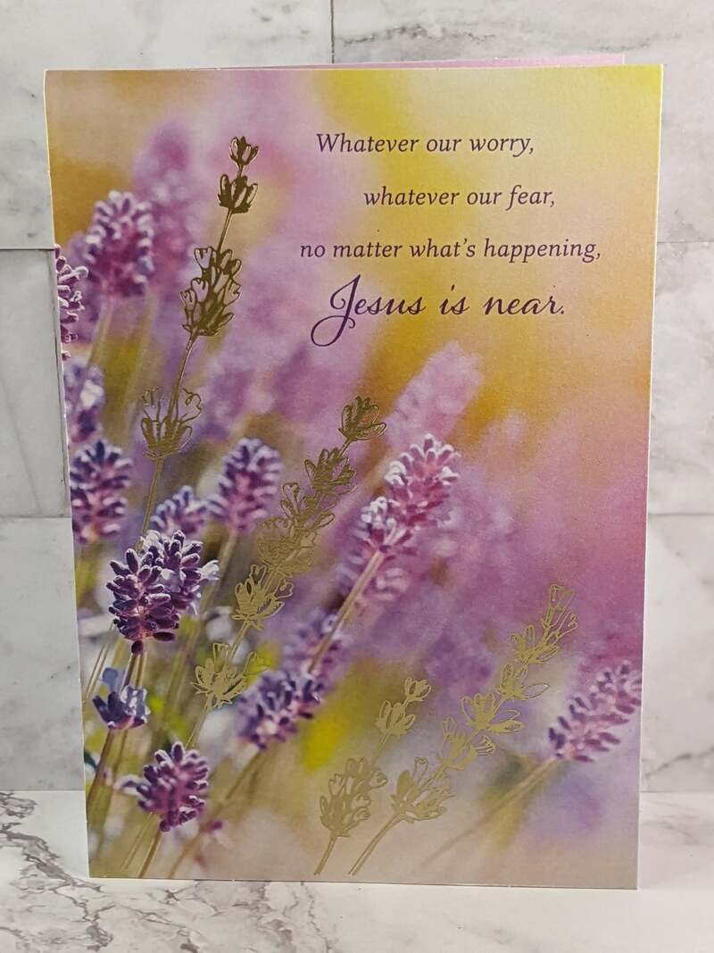 A religious greeting card with a golden cover with an image of lavender flowers and a Christian message of hope.
