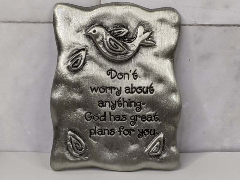 "Don't worry about anything - God has great plans for you." A pewter magnet with a bird design.